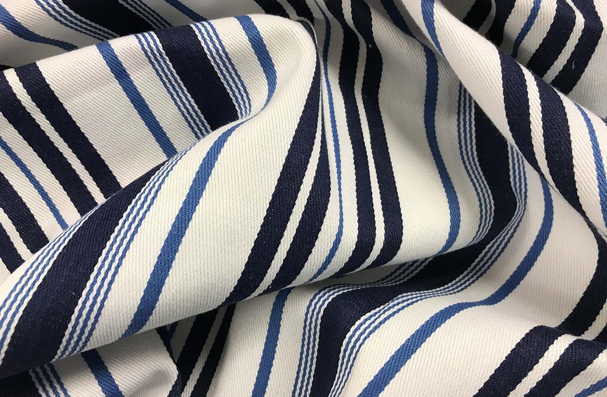 White, airforce blue and navy ticking striped fabric